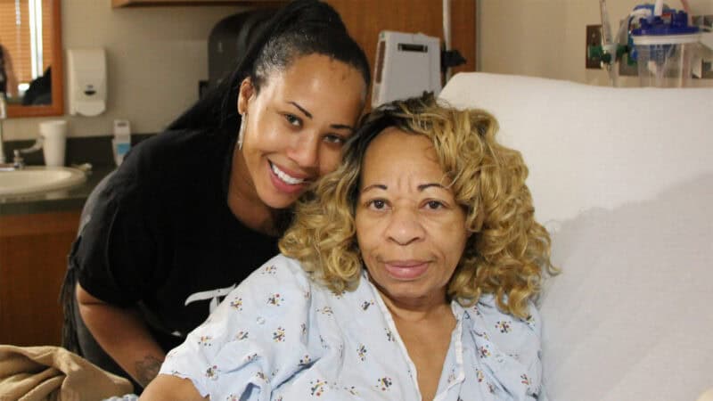 Laquinda Patrick and mom Jeanette embrace after getting Atlanta housing assistance from 211