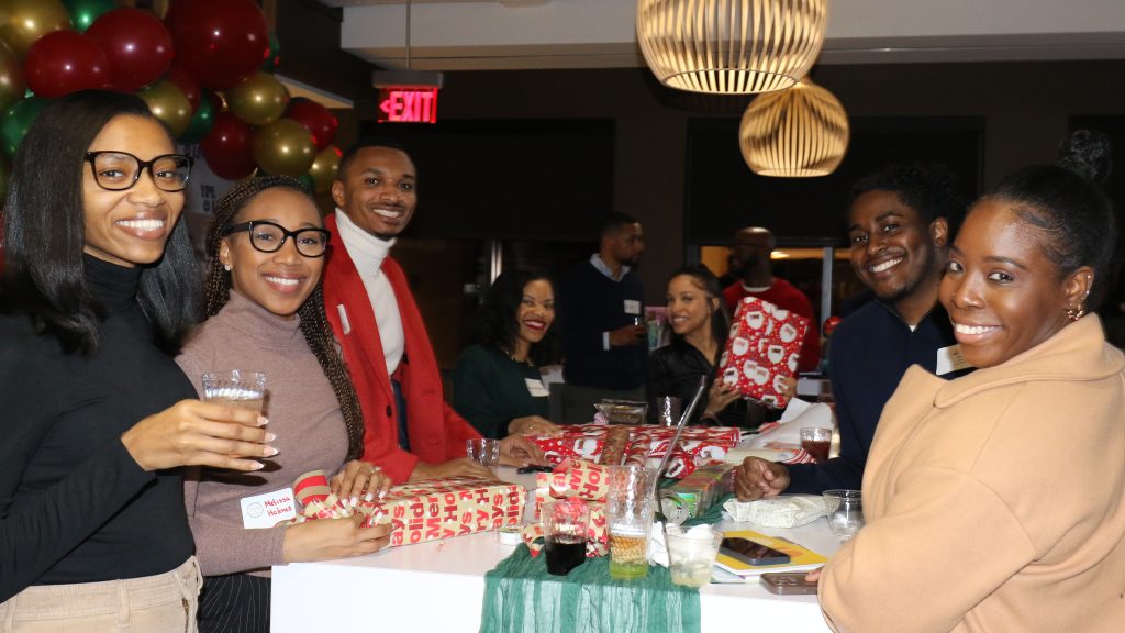 United Way of Greater Atlanta’s Young Professional Leaders (YPL) wraps holiday gifts for a toy drive