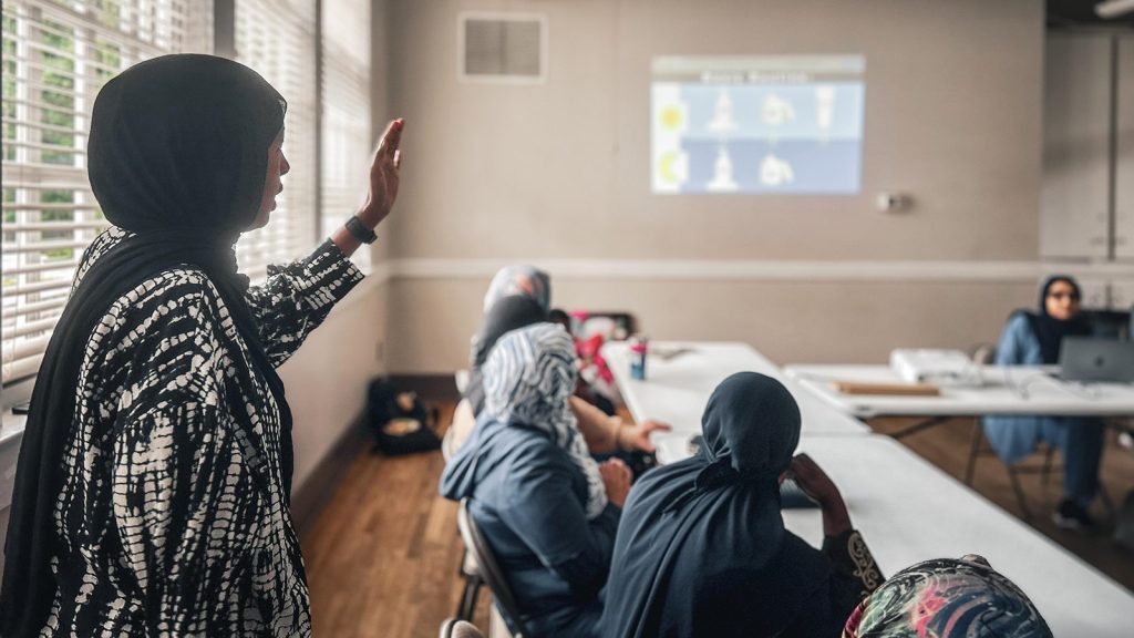 Twenty-five refugee and immigrant women learn about skincare at a Refugee Women’s Network Wellness Group led by an Emory healthcare professional and translated by Community Healthcare Workers